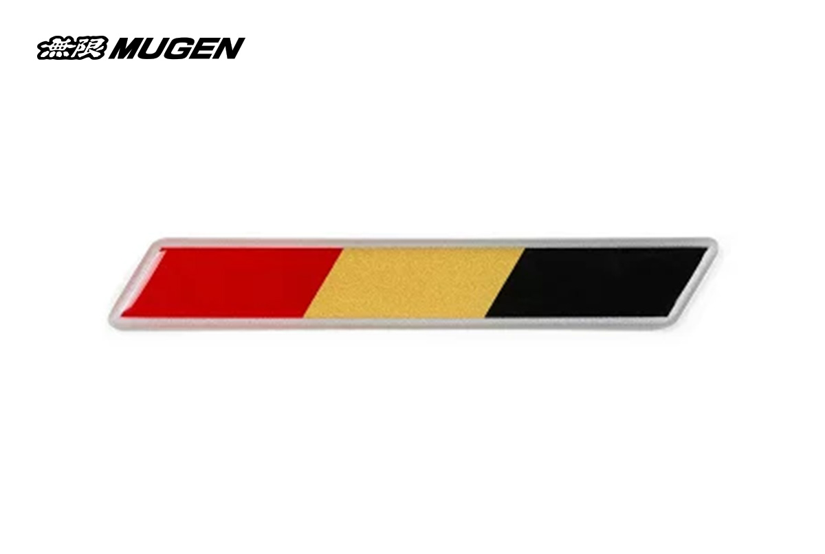 A close-up of the Mugen Tricolor Potting Emblem, featuring a rectangular design with white, red, and gold stripes, a silver/clear border, and the Mugen logo in the center, on a clean background.